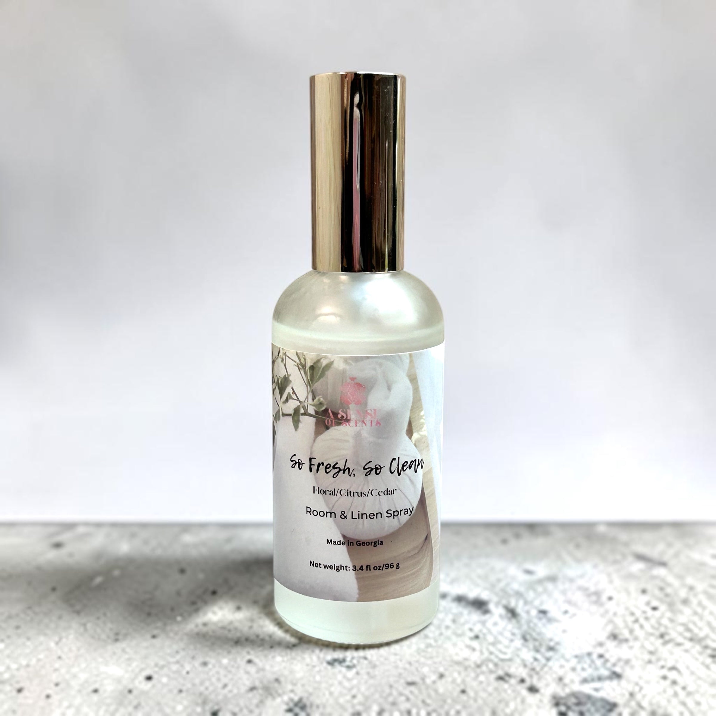 Room spray bottle with label on a light background