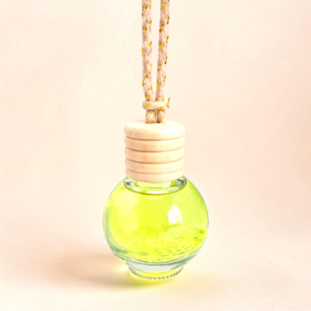 Peaches hanging car diffuser by A Sense of Scents, a non-toxic peach-scented car air freshener